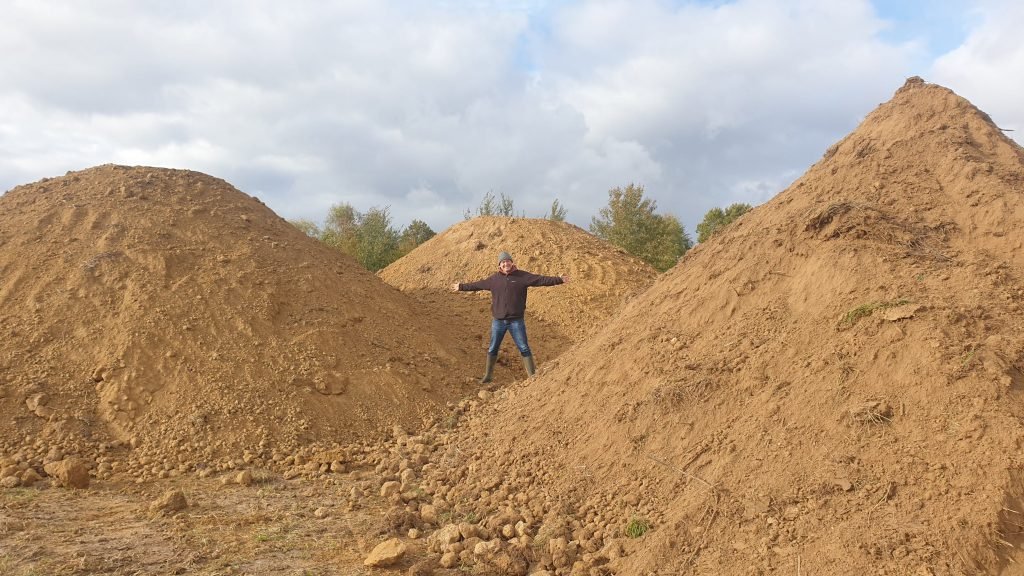 Alexis in the mountains of clay dug out new ponds
